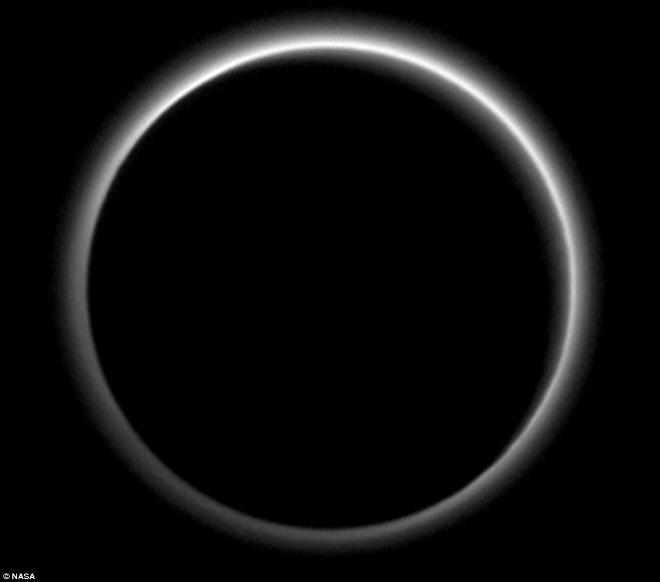 Farewell Pluto! Backlit by the sun, Pluto